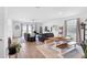 Open-concept living space with bright, neutral walls and sliding glass doors at 2388 Volunteer Ave, Kissimmee, FL 34744