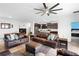 Bright, open concept living room flows into the kitchen, complete with ceiling fan and modern finishes at 2388 Volunteer Ave, Kissimmee, FL 34744