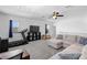 Loft area with plush seating, a treadmill, and entertainment center with lots of light at 2388 Volunteer Ave, Kissimmee, FL 34744