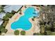 Aerial shot of the resort-style community pool with lounge chairs and a play area at 2388 Volunteer Ave, Kissimmee, FL 34744