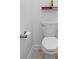 Close-up of a standard toilet in a bathroom with neutral-colored walls and flooring at 2388 Volunteer Ave, Kissimmee, FL 34744