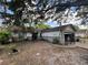Charming single-story home with a combination of white and gray brick, complemented by mature trees at 2558 El Capitan Dr, Sanford, FL 32773