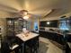 An eat-in kitchen features dark cabinets and tiled floors at 2558 El Capitan Dr, Sanford, FL 32773