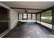 A view of the patio, enclosed with screens and black frames at 2558 El Capitan Dr, Sanford, FL 32773