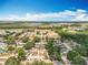 Wide aerial shot of the area showcasing the neighborhood, the road, trees, lakes, and the horizon at 2571 Edmond Cir, Auburndale, FL 33823