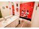 Bathroom with white vanity and Mickey Mouse themed shower curtain at 2788 Almaton Loop # 202, Kissimmee, FL 34747
