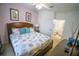 Serene bedroom with a decorative bed, framed wall art, and ensuite bathroom access at 2788 Almaton Loop # 202, Kissimmee, FL 34747