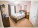 Comfortable bedroom with ceiling fan, dresser and bedside table with lamp at 2788 Almaton Loop # 202, Kissimmee, FL 34747