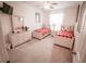 bedroom with ceiling fan and two twin beds featuring Mickey Mouse sheets at 2788 Almaton Loop # 202, Kissimmee, FL 34747