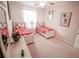 bedroom with ceiling fan and two twin beds featuring Mickey Mouse sheets at 2788 Almaton Loop # 202, Kissimmee, FL 34747