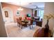 Open dining area flowing into the living room, featuring a glass-top table and neutral decor at 2788 Almaton Loop # 202, Kissimmee, FL 34747