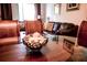 Close-up of dining table, showcasing glass top, decorative centerpiece, and living room background at 2788 Almaton Loop # 202, Kissimmee, FL 34747