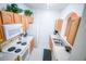Functional kitchen with ample cabinet space, white appliances, and a clean design at 2788 Almaton Loop # 202, Kissimmee, FL 34747