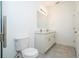 Bright bathroom featuring double sinks, granite countertops, and tile flooring at 2807 Sw 161St Loop, Ocala, FL 34473