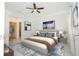 Stylish bedroom with a large bed, modern decor, and plenty of natural light at 2807 Sw 161St Loop, Ocala, FL 34473