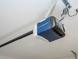 View of a modern garage door opener with chain drive and safety features at 2807 Sw 161St Loop, Ocala, FL 34473