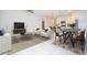 Open-concept living space with modern furniture, stylish decor, a dining area, and a view into the kitchen at 2807 Sw 161St Loop, Ocala, FL 34473