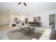 Stylish, open-concept living space features a seamless flow between the kitchen, dining, and living areas at 2807 Sw 161St Loop, Ocala, FL 34473