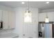 Modern pendant lights hang above the kitchen island at 2807 Sw 161St Loop, Ocala, FL 34473