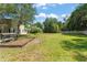 Expansive backyard with lush green grass and mature trees at 2827 Park Meadow Dr, Apopka, FL 32703