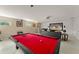 Finished basement with a pool table, large screen, and comfortable seating area at 2827 Park Meadow Dr, Apopka, FL 32703