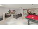 Spacious basement featuring a pool table, entertainment area, and comfortable seating at 2827 Park Meadow Dr, Apopka, FL 32703