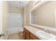 Well-lit bathroom featuring a shower-tub combination and spacious vanity at 2827 Park Meadow Dr, Apopka, FL 32703