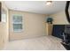 Bedroom with neutral colors, a window with natural light and an exercise bike at 2827 Park Meadow Dr, Apopka, FL 32703