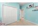 Bedroom with plush carpeting, bi-fold closet doors, shelving, and neutral paint and trim at 2827 Park Meadow Dr, Apopka, FL 32703
