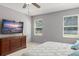 Bedroom with modern decor and natural light, offering a peaceful retreat at 2827 Park Meadow Dr, Apopka, FL 32703
