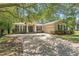 Charming home featuring brick driveway, manicured lawn, double doors and a two car garage at 2827 Park Meadow Dr, Apopka, FL 32703