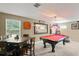 Game room featuring a billiards table and dining area with natural lighting at 2827 Park Meadow Dr, Apopka, FL 32703