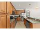Spacious kitchen with modern appliances and an island with a sink at 2827 Park Meadow Dr, Apopka, FL 32703