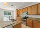Well-equipped kitchen with granite countertops and stainless steel appliances at 2827 Park Meadow Dr, Apopka, FL 32703
