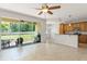 Bright living room featuring an open floor plan and sliding doors to the backyard at 2827 Park Meadow Dr, Apopka, FL 32703