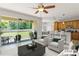 Bright living room featuring an open floor plan and sliding doors to the backyard at 2827 Park Meadow Dr, Apopka, FL 32703
