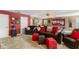 Spacious living room with plush seating, a billiards table, and neutral carpeting at 2827 Park Meadow Dr, Apopka, FL 32703
