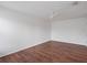 Bedroom featuring wood floors, white walls, a ceiling fan, and a door at 2853 Strand Cir, Oviedo, FL 32765