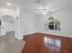 Open living area with hardwood floors, bright arch window and direct access to the kitchen at 2853 Strand Cir, Oviedo, FL 32765