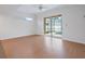Large room with a sliding glass door to a screened patio and pool at 2853 Strand Cir, Oviedo, FL 32765