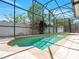 Inviting screened-in pool with clear water, perfect for relaxing and entertaining in a private backyard setting at 2853 Strand Cir, Oviedo, FL 32765