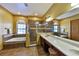Luxurious primary bathroom featuring a soaking tub, glass shower, and a spacious vanity with lots of counter space at 2921 Falconhill Dr, Apopka, FL 32712