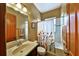 Full bathroom with tub/shower combo, decorative curtain, and vanity sink at 2921 Falconhill Dr, Apopka, FL 32712