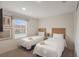 This bedroom has carpet, neutral colors, two twin beds, and a window at 3001 Red Ginger Rd, Kissimmee, FL 34747
