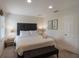 This bedroom features a king bed, neutral colors, carpet, a window, and modern decor at 3001 Red Ginger Rd, Kissimmee, FL 34747