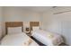This bedroom has carpet, neutral colors, two twin beds, and closet at 3001 Red Ginger Rd, Kissimmee, FL 34747