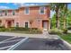 Inviting two-story townhome features an accessible entrance and well-maintained landscaping at 3001 Red Ginger Rd, Kissimmee, FL 34747