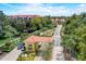 Inviting gated entrance with lush landscaping, a tile roof, and a manicured garden welcome you to this fabulous community at 3001 Red Ginger Rd, Kissimmee, FL 34747
