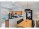 Well-appointed kitchen features granite countertops, stainless appliances, and a breakfast bar at 3001 Red Ginger Rd, Kissimmee, FL 34747