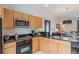 Functional kitchen boasts granite counters, modern appliances, and convenient access to living area at 3001 Red Ginger Rd, Kissimmee, FL 34747